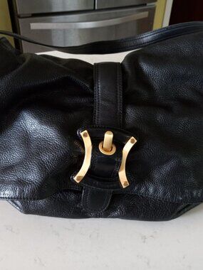 Black Leather B. Makowsky with Leopard interior lining